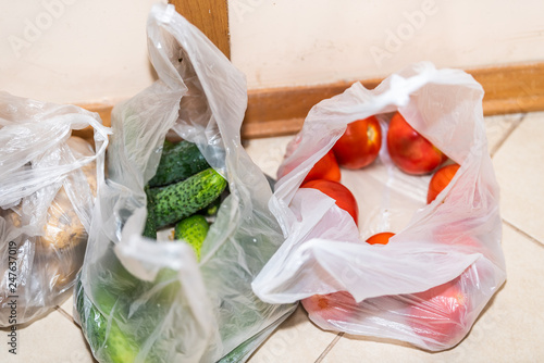 Closeup Of Fresh Green Grocery Produce Plastic Bags With Cucumbers