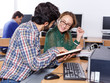 © JackF - Female and male students working in computer room in library