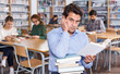 © JackF - Portrait of tired man sitting with books