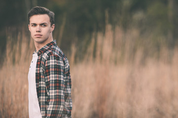 Young man at the park in the fall