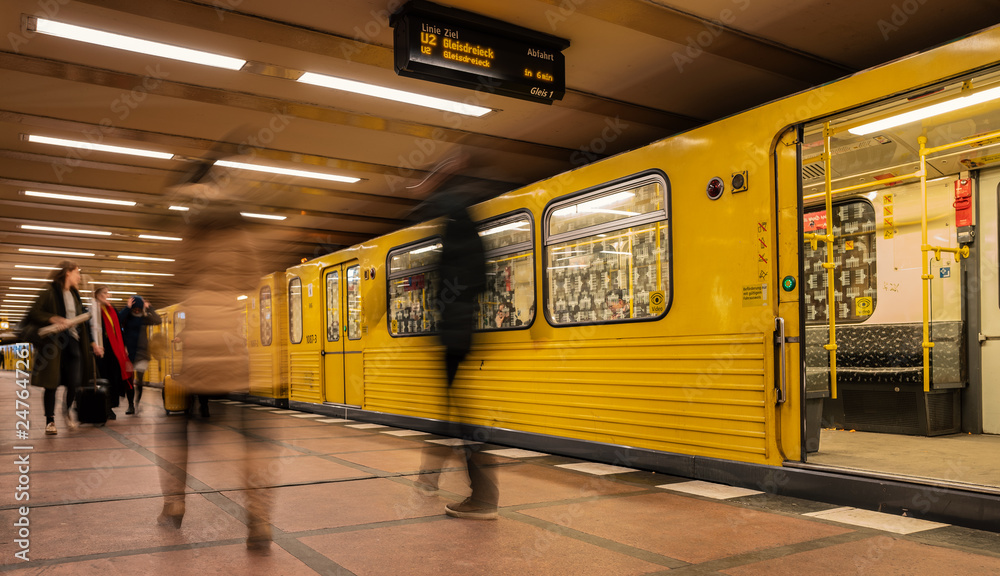 Obraz na płótnie Berlin subway moving train with passengers on the platform, Germany w salonie