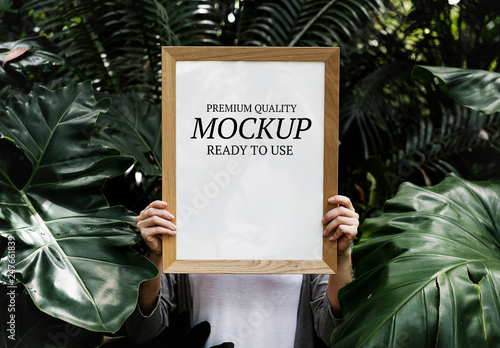 Download Person Holding Frame In Tropical Leaves Mockup Stock Template Adobe Stock