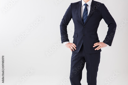 白背景で上半身のスーツの男性が機嫌が悪く腰に腕を組む Buy This Stock Photo And Explore Similar Images At Adobe Stock Adobe Stock 白背景で上半身のスーツの男性が機嫌が悪く腰に腕を組む Buy This Stock Photo And Explore Similar Images At Adobe Stock Adobe Stock