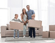 © ASDF - family moves the boxes to a new apartment.