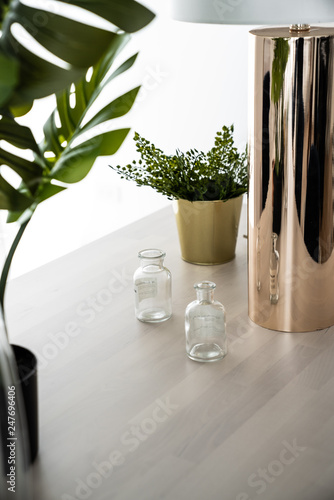 Composition Of Gold Mirror Vase And Mini Bottles Glass With