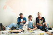 © Rawpixel.com - Cheerful family relaxing after painting the room