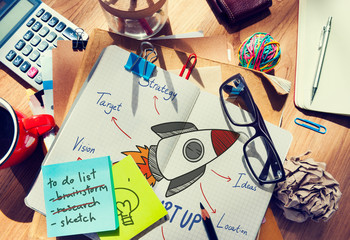 Wall Mural - rocket drawn in a notebook on a messy table