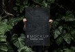 © Rawpixel.com - Female in a tropical background holding a signboard mockup