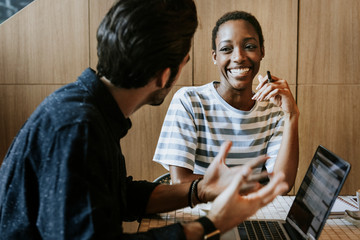 Canvas Print - Colleagues in a workspace working together