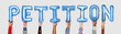 © Rawpixel.com - Hands holding petition word in balloon letters