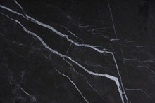 Natural Stone Italian Marble With White Stripes On A Dark Background, Called Nero Marquina