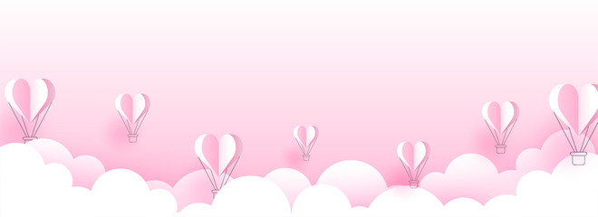 Poster - Paper cut style cloudy background with flying hot air balloons illustration for valentine's day header or banner design.