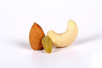 Wall Mural - ssorted nuts on white, dry fruits, mix nuts, almond, cashew,  raisin