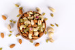 © dbhanu - ssorted nuts on white, dry fruits, mix nuts, almond, cashew, pistachio, raisin