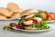 © Igor Normann - Sandwich with mozzarella, tomato and salad on the kitchen table.