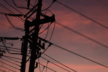 pylon electricity power line with sunset sky background