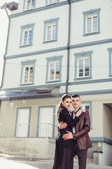 Wall Mural - Young hipster modern sexy couple in love hugging outdoors. Freedom, emotional, love, happiness concept