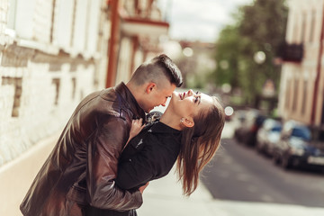 Wall Mural - Young hipster modern sexy couple in love hugging outdoors. Freedom, emotional, love, happiness concept