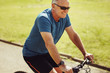 © Jacob Lund - Senior man riding a bicycle for fitness