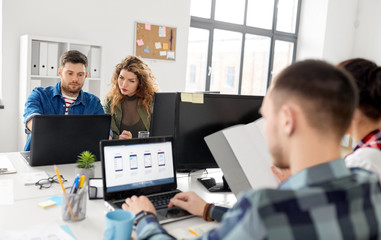 Wall Mural - business, technology and people concept - creative team or designers working on user interface at office