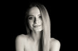 © Pixel-Shot - Black and white portrait of beautiful young woman on dark background