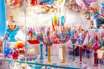 Colorful decorated objects made of a famous murano glass in a shop window in Venice