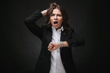 Poster - Shocked young businesswoman wearing a suit