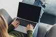 © LIGHTFIELD STUDIOS - cropped view of woman using laptop with blank screen