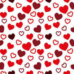 Simple hearts seamless vector pattern. Valentines day background. Flat design endless chaotic texture made of tiny heart silhouettes. Shades of red.