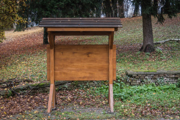 Informative board made of wood in the park