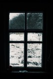Fototapeta Na ścianę - Worn window with a winter view. Old window in europe