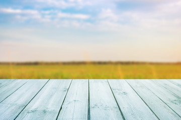 Wall Mural - blue table on blurred background of landscape with blue sky - can use for display or montage your product.Template mock up for display of product