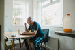 © dglimages - Retired Man Enjoying Breakfast