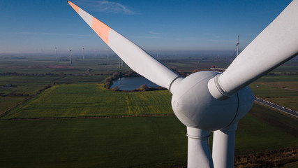 Wind turbine from aerial view. Windmill generator top. Beautiful background