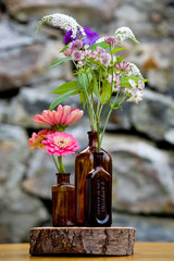 Wall Mural - Wedding flower arrangement series. Bouquet of flowers for a wedding event in blown bottles on wood