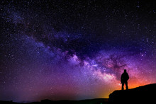Beautiful Starry Night, Man Silhouette With A Camera Looking At The Milky Way Galaxy.