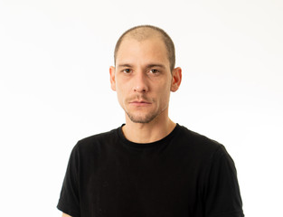 Human expressions and emotions. Portrait of young attractive man with a serious neutral face