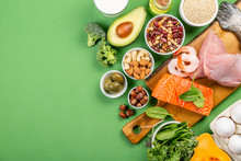 Mediterranean Diet Concept - Meat, Fish, Fruits And Vegetables On Bright Green Background