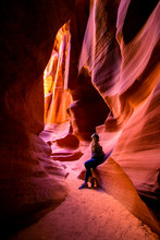 Impressed Young Traveler Woman Looking Up Inside Of The Antelope Canyon, Arizona, USA. 