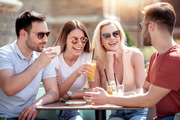 Canvas Print - Friends having great time in cafe