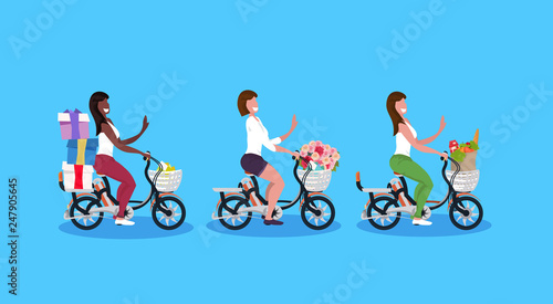 lady riding bike with baby in bag