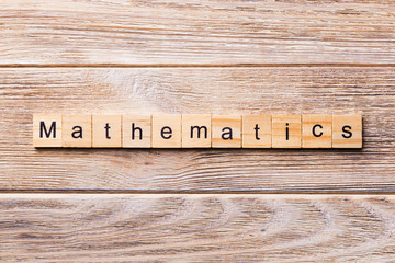 mathematic word written on wood block. mathematic text on wooden table for your desing, concept