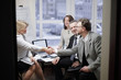 © yurolaitsalbert - business handshake women with a partner over a Desk