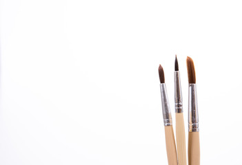 Painting brushes. Drawing tools, paint brushes on white background, copy space, top view