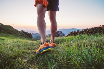 Wall Mural - man trail running on a mountain at the dask