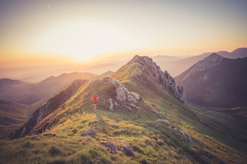Wall Mural - man trail running on a mountain at the dask