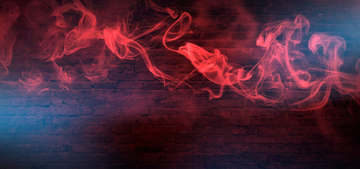 Red Smoke on a dark background. Dark empty room with rays of light, searchlight. Color correction, background.