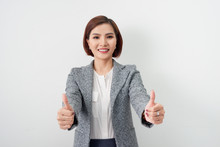 Asian Businesswomen Smiling And Thump Up On White Background