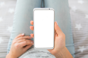 chroma key. holding mobile phone Mockup image of woman's hands. top view .white screen smartphone.