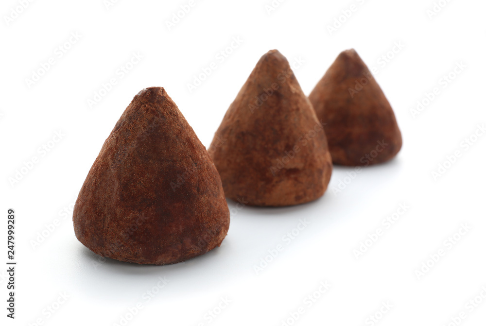 Tasty sweet truffles on white background